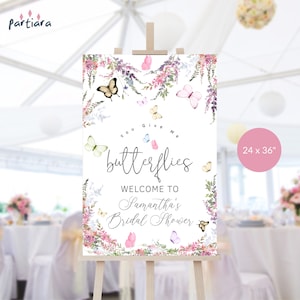 May include: A white welcome sign with a floral border and butterflies. The sign says "You Give Me Butterflies" and "Welcome to Samantha's Bridal Shower". The sign is 24 inches by 36 inches.