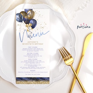 May include: A blue and gold menu card with a handwritten 'Menu' title and a blue ribbon with gold accents. The menu lists the courses for Anthony's 70th birthday celebration, including smoked salmon, tempura mushrooms, slow-cooked pork belly, and slow-roasted tomato.