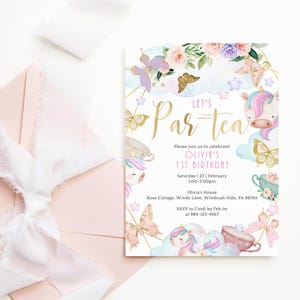 a pink and gold birthday party with a unicorn theme