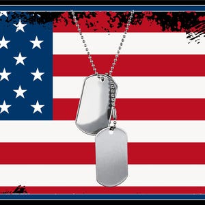 May include: Two silver dog tags on a chain, hanging in front of an American flag with red and white stripes and blue stars. The flag has a distressed, vintage look.