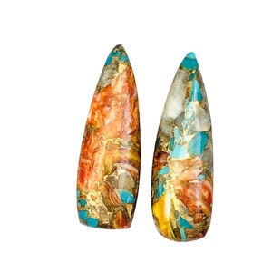 May include: A pair of teardrop-shaped cabochon stones with a mix of orange, brown, gold, and turquoise colors. The stones have a marbled, swirling pattern.