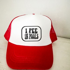 May include: A red and white trucker hat with a black and white graphic that says "I PEE IN POOLS".