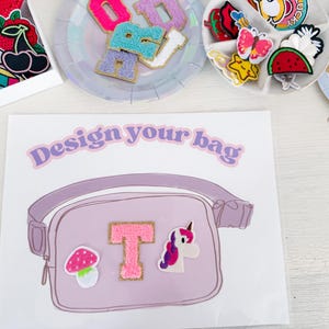 May include: A light purple fanny pack design with a pink letter "T" patch, a mushroom patch, and a unicorn patch. The text "Design your bag" is above the fanny pack illustration. Patches and letters are on plates.