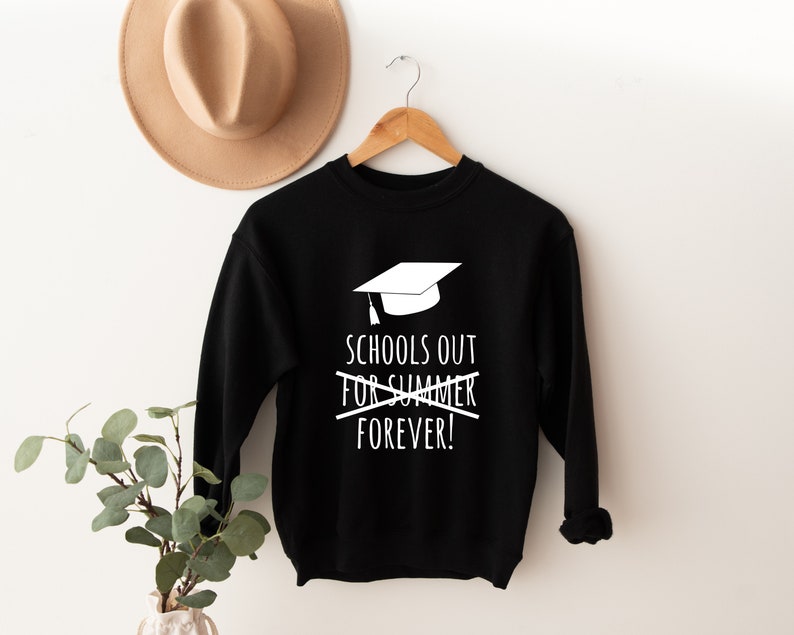 May include: Black sweatshirt with a white graduation cap graphic and the text "Schools out for summer forever!" printed on the front.