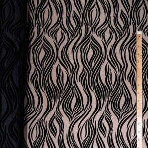 May include: Black and beige fabric with a wavy, abstract pattern. The fabric is sheer and has a delicate texture.