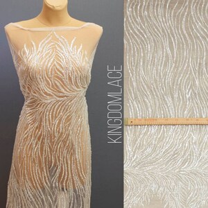 Montre Fabric lace embroidered with beads and sequins based on flesh color, Different edge on both sides. Wedding  fabric lace Width 51 Wave