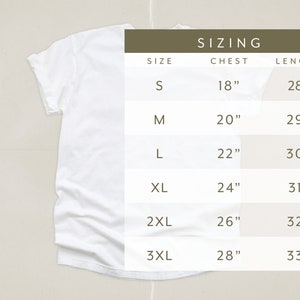 May include: Sizing chart for a t-shirt with measurements in inches for chest and length. Sizes include S, M, L, XL, 2XL, and 3XL.