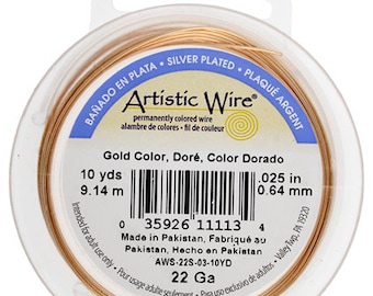 May include: A spool of gold-colored Artistic Wire, 22 gauge, silver-plated, 10 yards (9.14 meters) long. The label reads "Gold Color, Doré, Color Dorado" and includes a barcode and the text "Made in Pakistan".