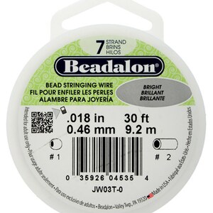 May include: A white spool of Beadalon bead stringing wire. The package includes the text "7 Strand", "Bright", and measurements of .018 in, 30 ft, and 0.46 mm, 9.2 m. The product is made in the USA.
