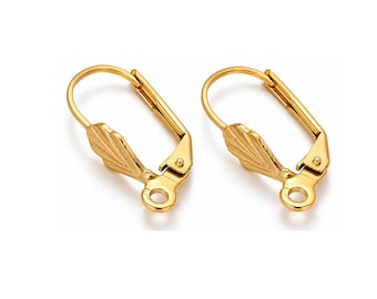 May include: A pair of gold-toned leverback earring findings featuring a hinged closure mechanism and a decorative shell-like fan design at the base, with a small circular loop at the bottom for attaching jewelry components.