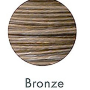 May include: A circular swatch of bronze-colored hair dye, showcasing a blend of brown and gold tones. The word "Bronze" is printed in a black, sans-serif font below the swatch, indicating the color name.