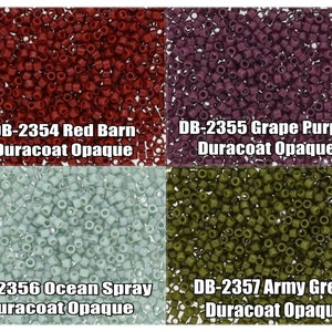 May include: Four different colors of seed beads, Red Barn, Grape Purple, Ocean Spray, and Army Green. Each color is labeled with the color name and the code DB-2354, DB-2355, DB-2356, and DB-2357. Duracoat Opaque is also labeled on each color.
