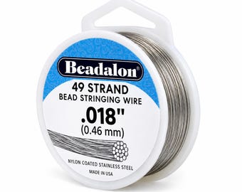 May include: A spool of Beadalon 49 strand bead stringing wire, measuring .018 inches in diameter. The silver-colored wire is made of nylon-coated stainless steel and is wound around a white plastic spool with blue and white labeling.