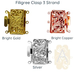 Puede incluir: Tres cierres de filigrana para la elaboración de joyas. Los cierres se muestran en oro brillante, cobre brillante y plata.