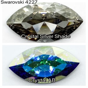 Peut inclure: Deux pierres en cristal Swarovski 4227. La pierre du haut est de couleur argent&eacute;e. La pierre du bas est un cristal AB, qui a une finition bleue, verte et iris&eacute;e.