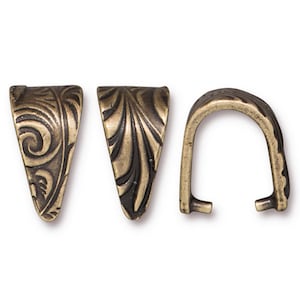 May include: Three antique brass pendant bails with an ornate floral design. The bails are in the shape of a V and a U.