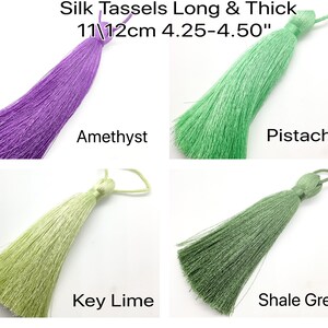 May include: Four silk tassels in different colours: amethyst, pistachio, key lime, and shale green. Each tassel is approximately 11 to 12 centimetres (4.25 to 4.50 inches) long.