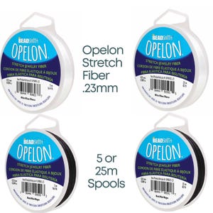 May include: Four spools of Opelon stretch jewelry fiber. Two spools are white, and two are black. Each spool contains 25 meters of .23mm fiber. The packaging includes the brand name, product details, and the text "Stretch Jewelry Fiber".