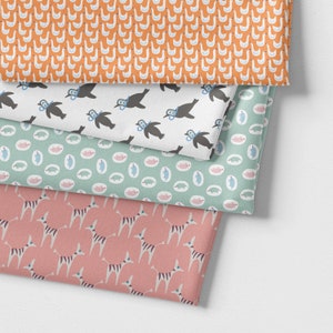 May include: A stack of three fabric swatches with different patterns. The top swatch features a white background with a repeating pattern of orange geese. The middle swatch features a white background with a repeating pattern of black and blue penguins. The bottom swatch features a pink background with a repeating pattern of white and black zebras.