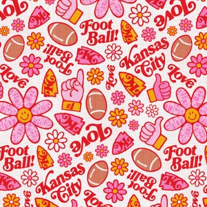 May include: A white fabric pattern with red text including "Love," "Foot Ball!," and "Kansas City." The design features American footballs, flowers, and pink and orange accents like a thumbs-up and a KC arrowhead.