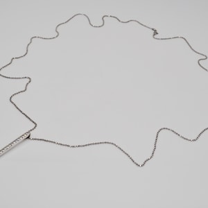 May include: A handmade, wooden serving tray with a natural finish. The tray features a rectangular shape with raised edges and integrated handles. Dimensions are approximately 16 inches long, 10 inches wide, and 2 inches high.