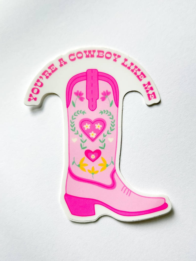May include: Pink cowboy boot sticker with floral embroidery and the text "You're a cowboy like me".
