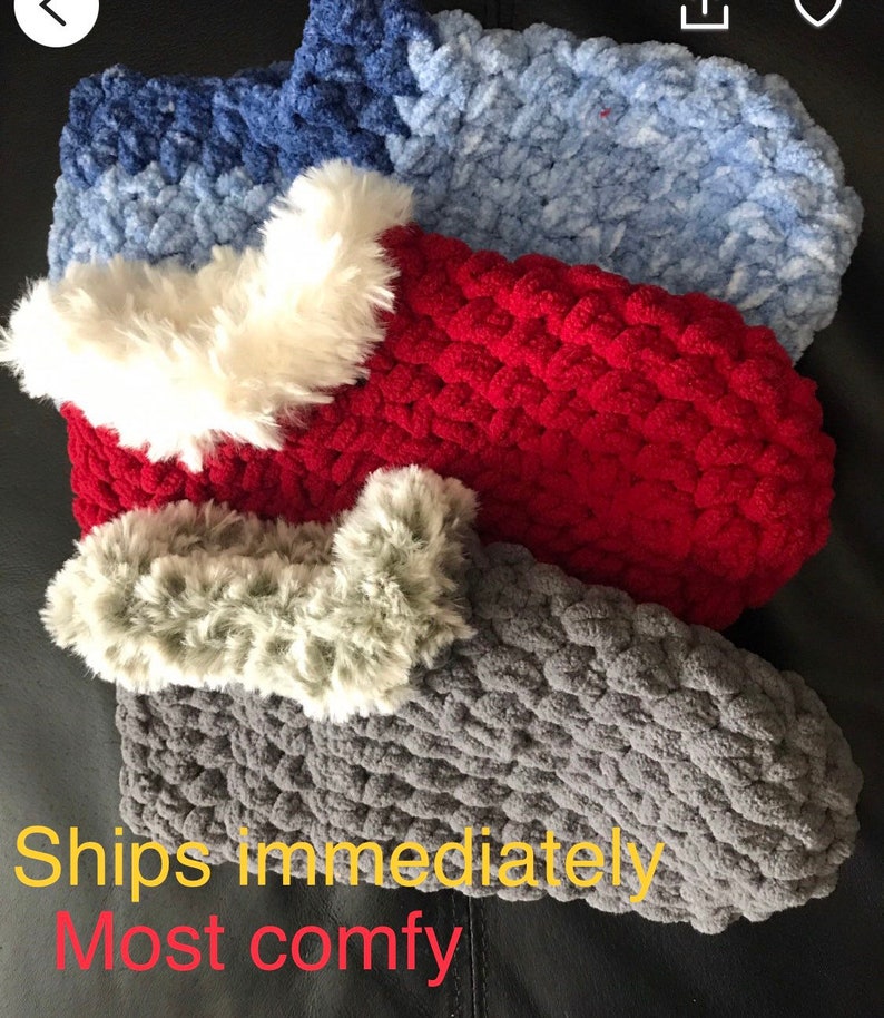 May include: Three pairs of cozy knitted slippers with faux fur trim. The slippers are in shades of gray, red, and blue.