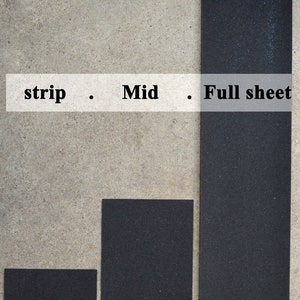 May include: Three black sandpaper sheets of different sizes. The smallest sheet is approximately 9 by 4 inches, the middle sheet is approximately 9 by 11 inches, and the largest sheet is approximately 9 by 33 inches.