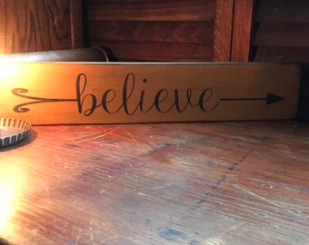 Believe (arrow) Sign