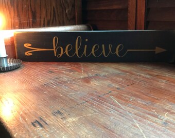 Believe (arrow) Sign