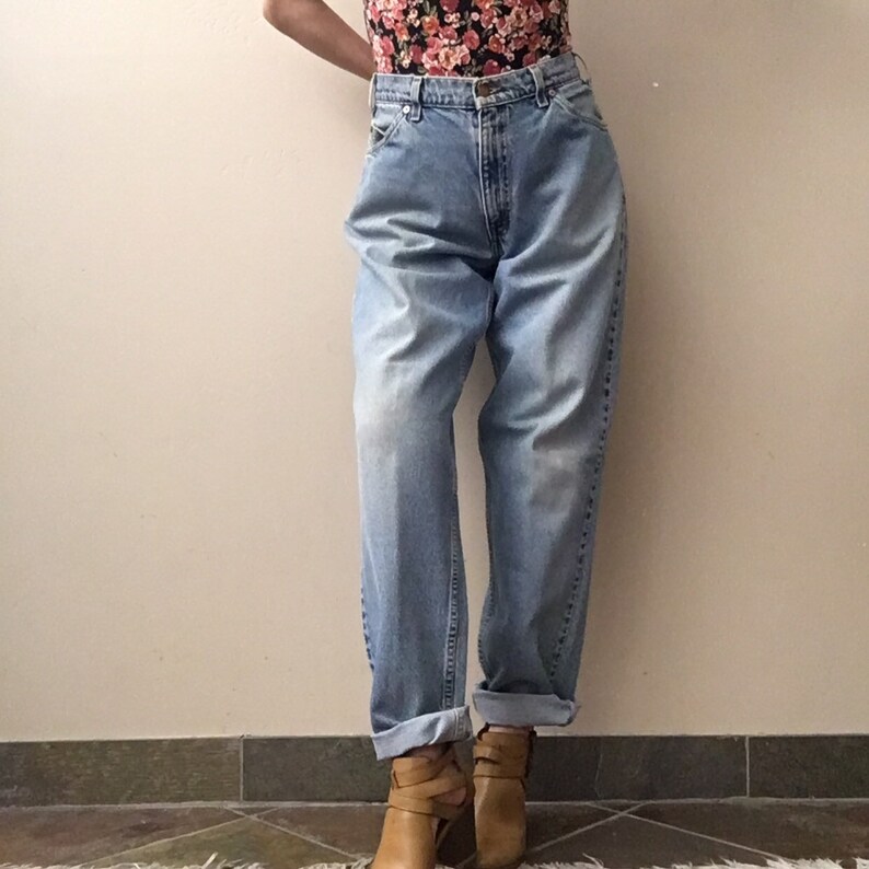 Vintage Levi\u2019s 560 orange tab high waisted mom jeans size 33 34