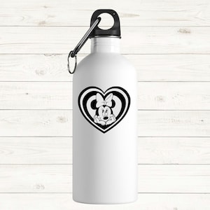 May include: A white water bottle with a black lid and carabiner clip. The bottle features a black and white graphic of Minnie Mouse inside a heart shape. The background is a white wooden surface.