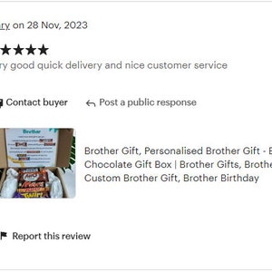 May include: A brown cardboard box with the word "Brother" printed on the lid. The box is open and contains a variety of chocolate bars. The chocolate bars are wrapped in colorful foil and have different brand names printed on them. The box is sitting on a green surface.