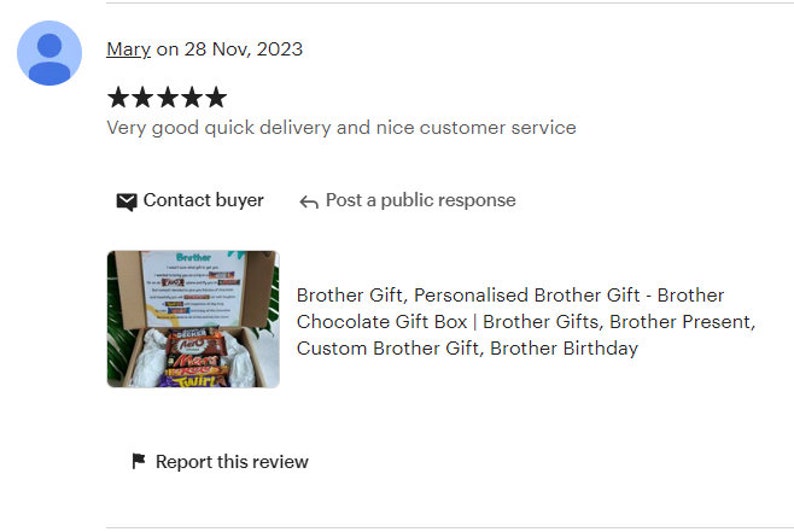 May include: A brown cardboard box with the word "Brother" printed on the lid. The box is open and contains a variety of chocolate bars. The chocolate bars are wrapped in colorful foil and have different brand names printed on them. The box is sitting on a green surface.