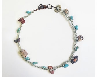 Bracciale intrecciato con pietre