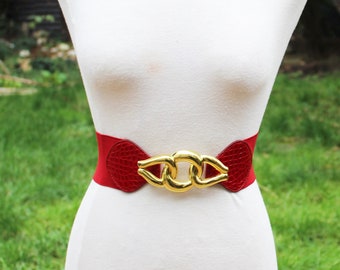 Ceinture rouge vintage des années 1980 avec boucle tourbillonnante