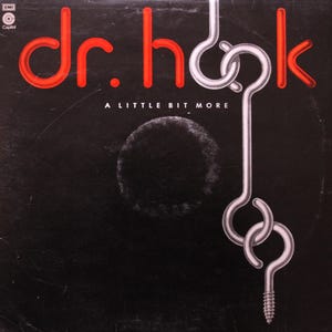 May include: Album cover for Dr. Hook's "A Little Bit More." The title and artist name are in red, with the artist's name in a stylized font. A silver hook design is on the right side. The background is black.