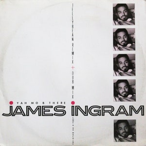 May include: A white record cover with a black and white photo of James Ingram. The title of the record is "Yah Mo B There" and the text "Jelly Bean Remix + Dub Mix" is printed vertically on the right side of the cover.