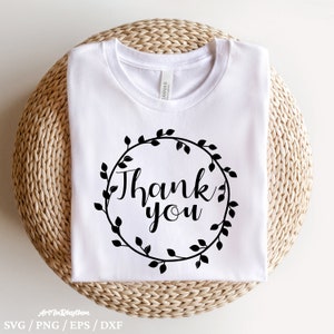 May include: White t-shirt with a black wreath design and the text "Thank you" in a cursive font.
