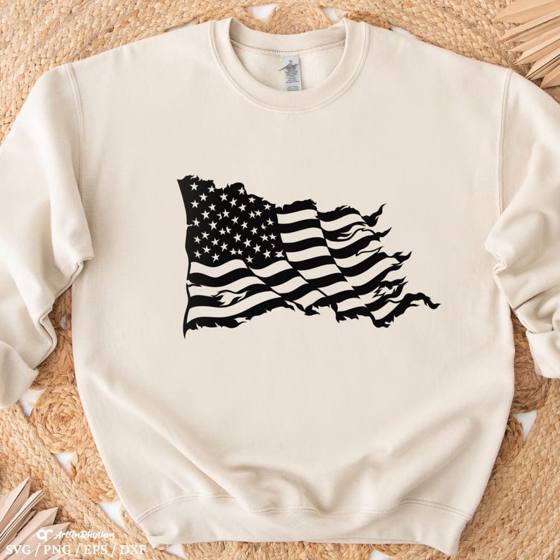 May include: A cream-colored sweatshirt with a black distressed American flag graphic printed on the front.