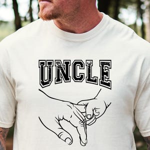 Uncle Pinky holding baby, Uncle shirt svg, soon to be uncle PNG, Expecting uncle Dtf, Baby announcement shirt Sublimation, Baby shower svg
