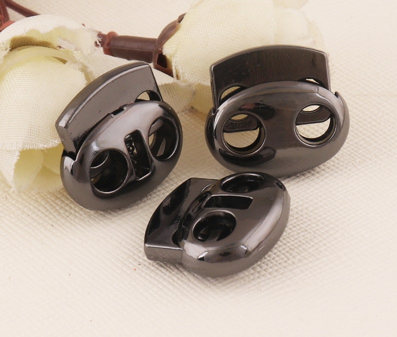 Gunmetal Spring Cord Lock Oval Bean Double Holes Cord L Gunmetal Spring Cord Lock Oval Bean Double Holes Cord L
