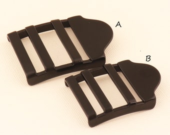 May include: Two black plastic strap adjusters, labeled A and B.  The adjuster labeled A is larger than the adjuster labeled B.