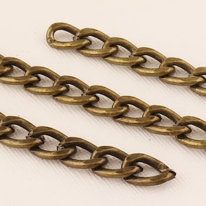 May include: Three pieces of gold-toned metal chain with a curb link design.