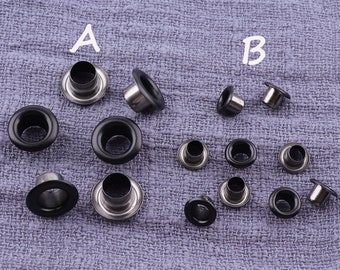 May include: Assortment of metal eyelets in black and silver. The eyelets are arranged in two groups labeled A and B.