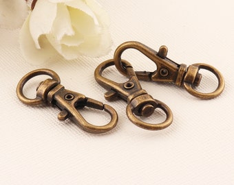 Lobster clasp,Metal clasps,Purse clasp,Chain clasp,Hook clasp,Swivel snap hooks,Purse hook,Swivel hook,Bag clasps