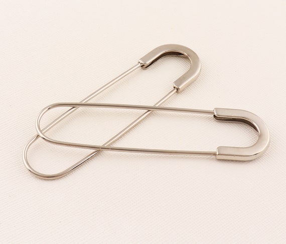 I use safety pins for everything! Its a great NO- SEW and