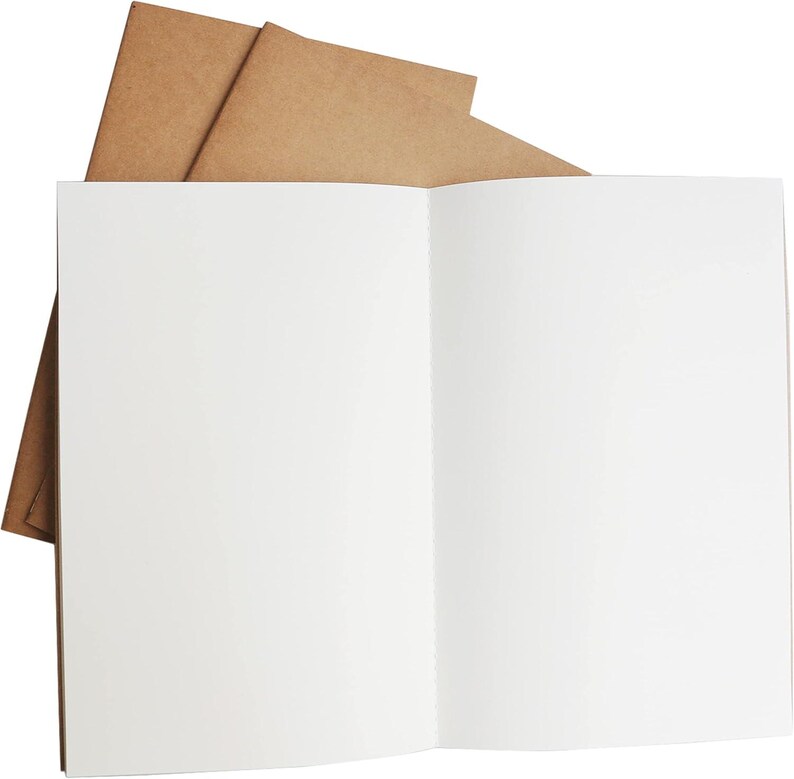 May include: A blank, white notebook with a brown paper cover. The notebook is open to a blank page.