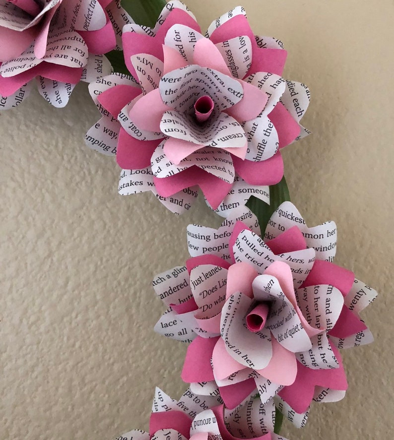 Book flower wreath done in two tone pink flowers with greenery accents Breast Cancer Awareness