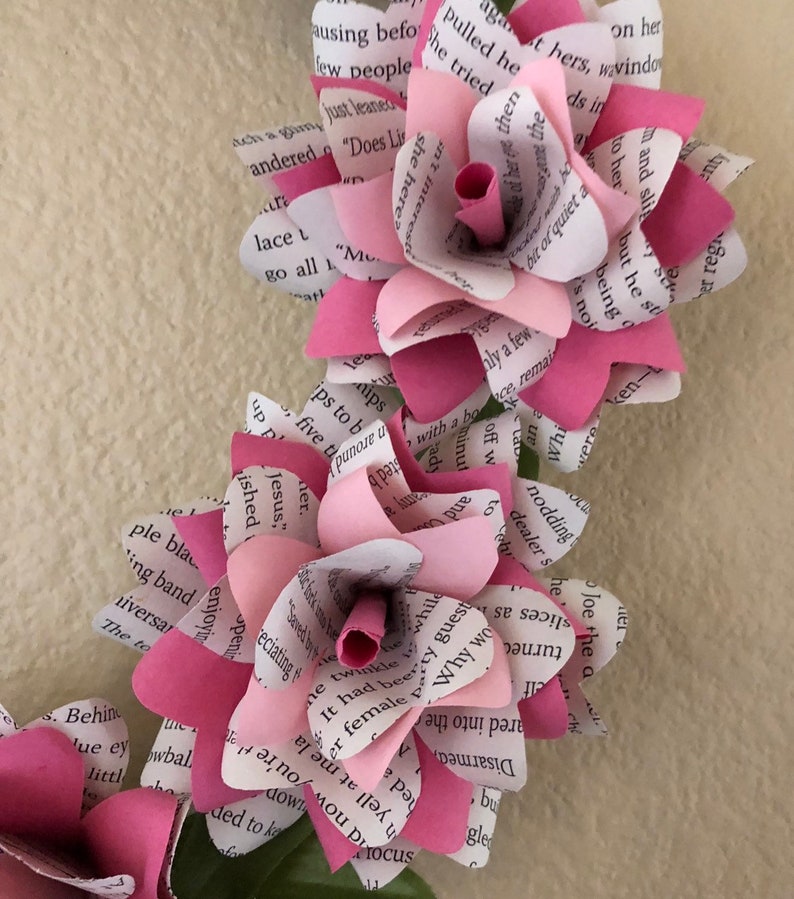 Book flower wreath done in two tone pink flowers with greenery accents Breast Cancer Awareness